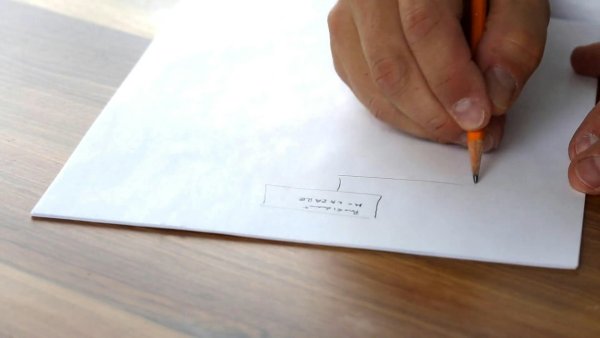 Close-Up Of Hand Sketching Business Plan On Paper With Pencil. (Thumbnail)