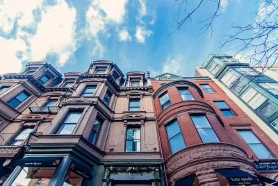Brown Concrete Building Under Blue Sky During Daytime